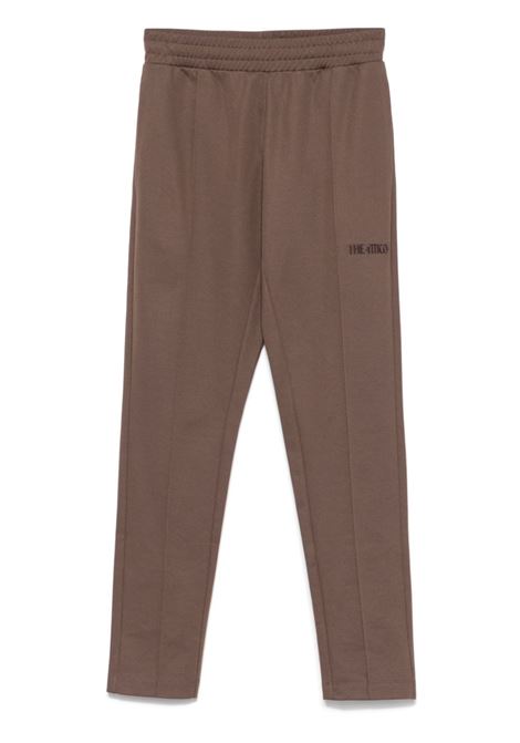 Brown logo-detail trousers The attico - women